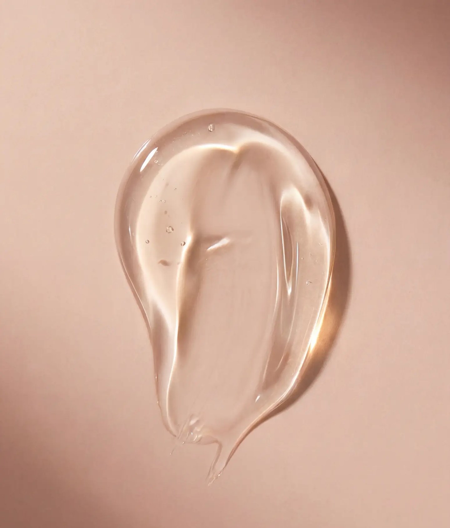 Texture still - clear oil swatch on warm rose, AI generated and art directed by me