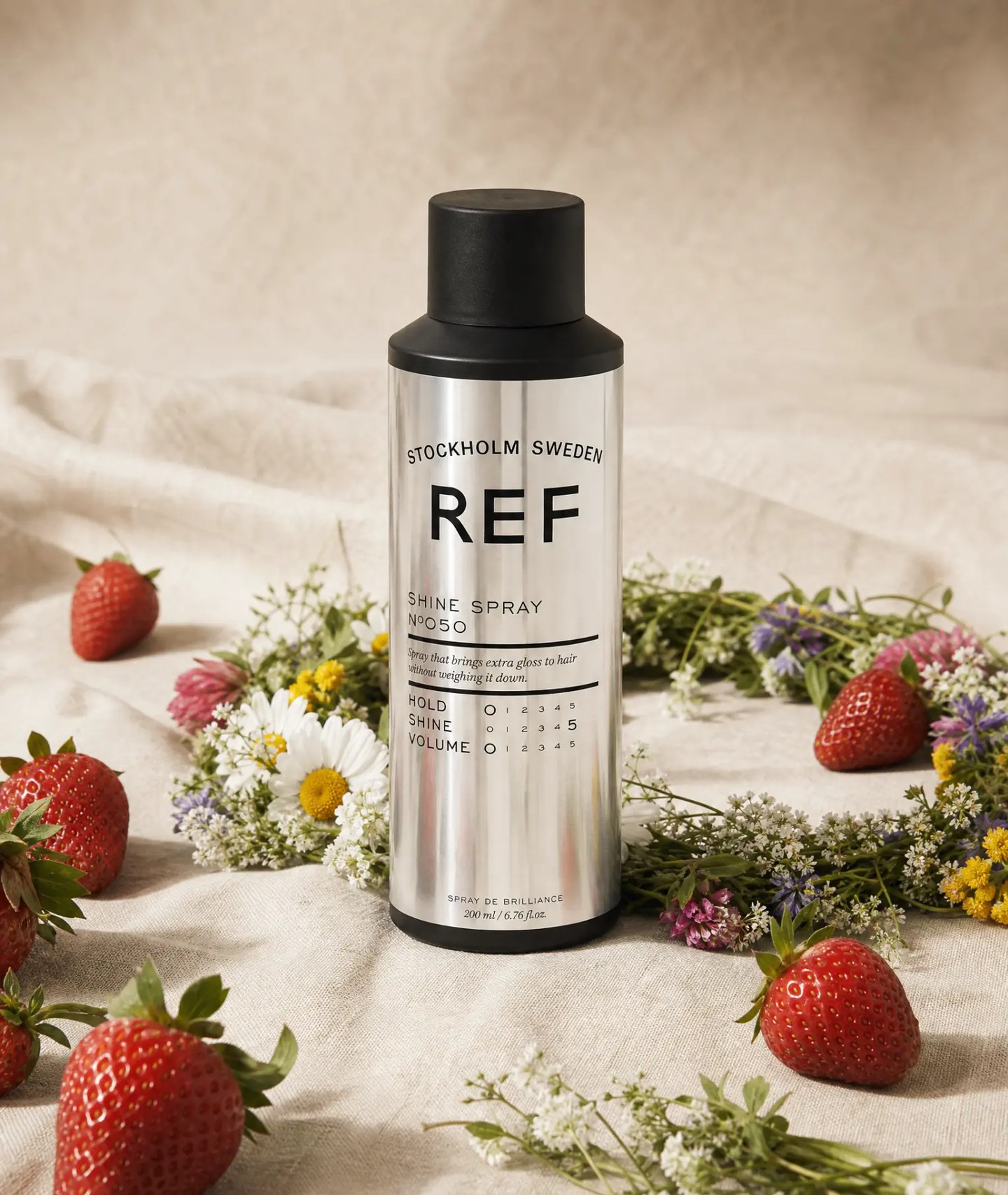 Campaign still - shine spray on linen with strawberries and a midsummer crown, AI generated and art directed by me