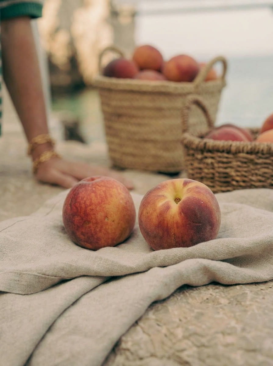 Still life - peaches on washed linen by the water, AI generated and art directed by me