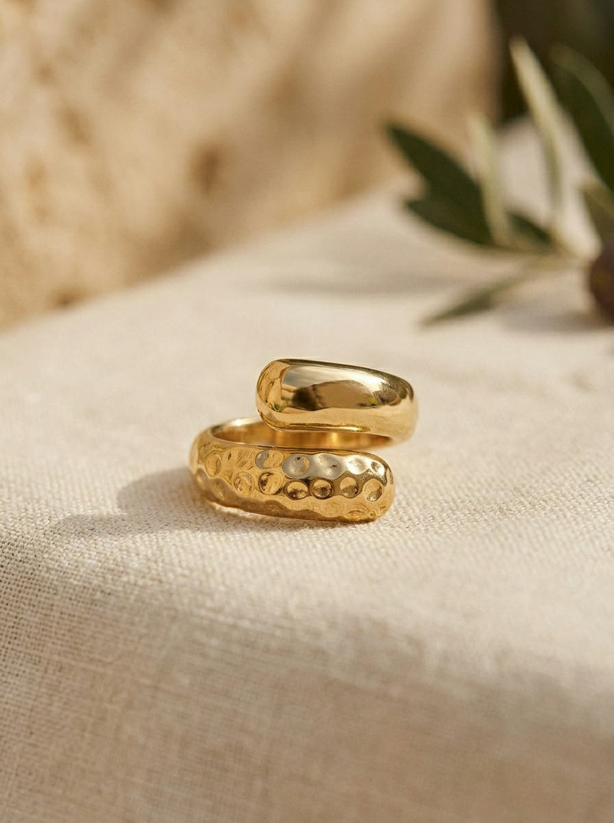 Product still - hammered and dome rings on raw linen, AI generated and art directed by me