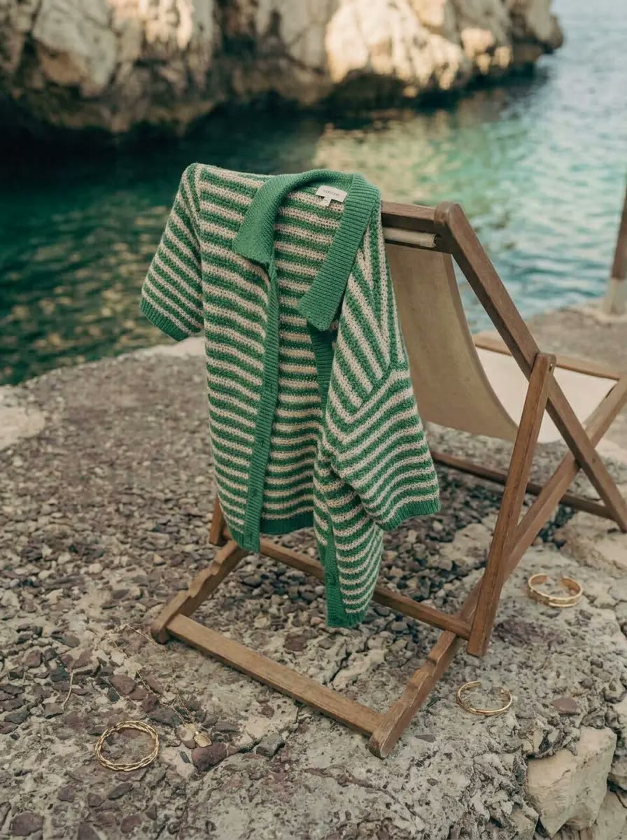 Product shot - striped knit set with gold cuffs, AI generated and art directed by me