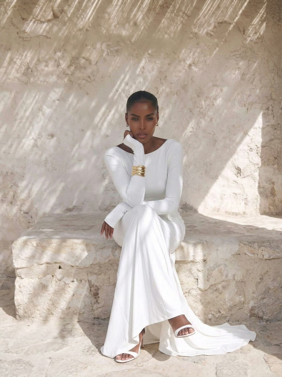 Stone courtyard chapter - seated full length in white jersey, AI generated and art directed by me